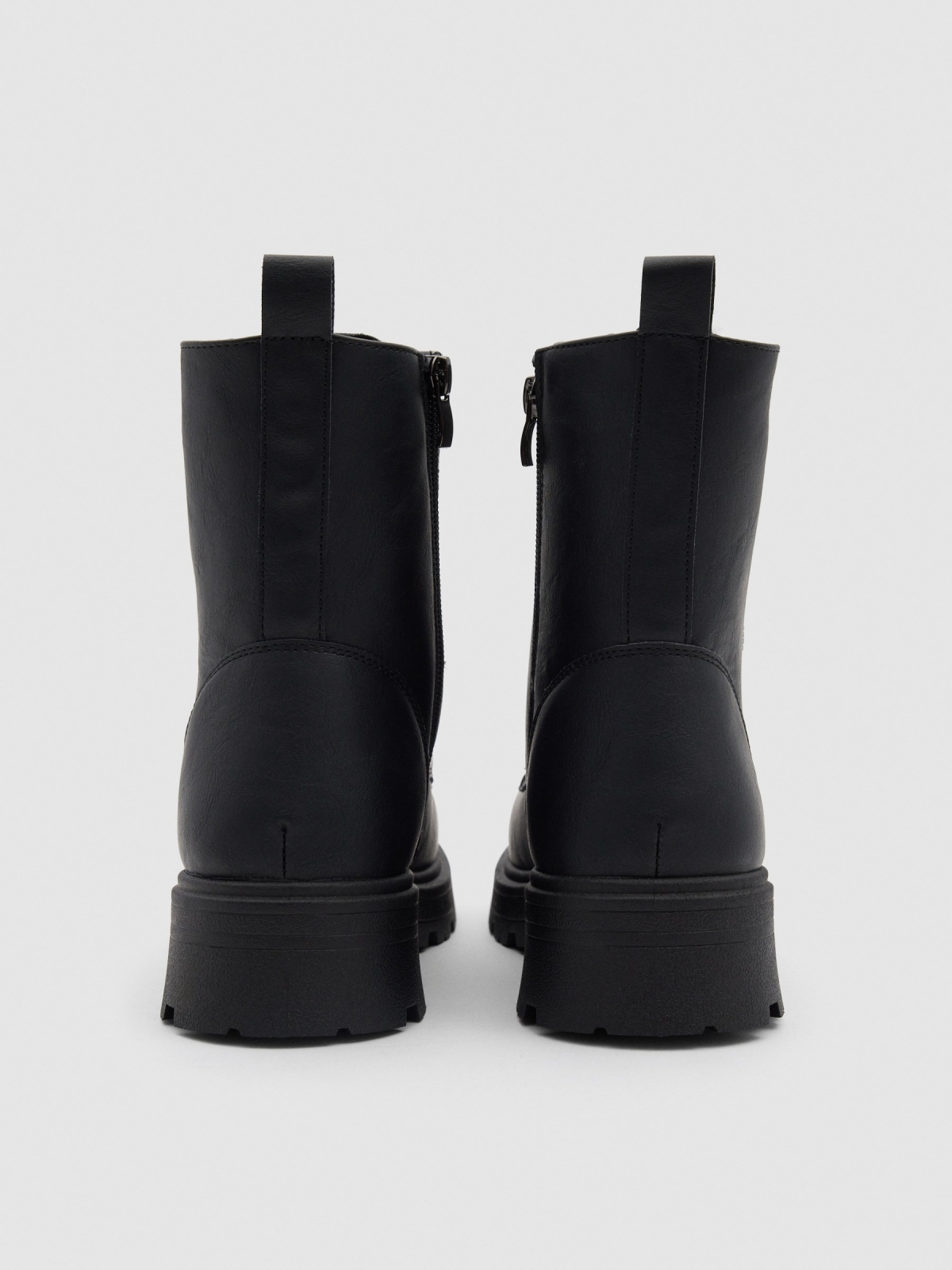 Black military boot with track sole black detail view