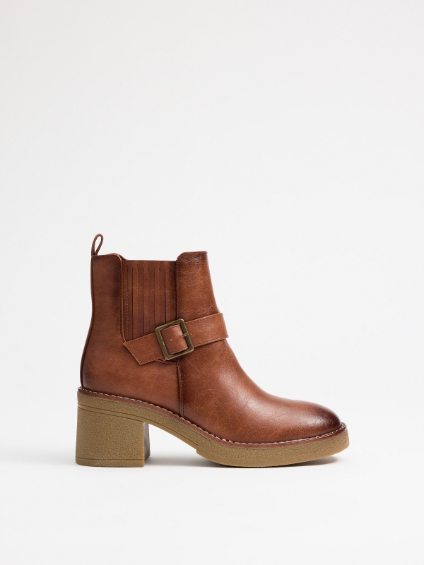 Brown boots with strap brown profile view