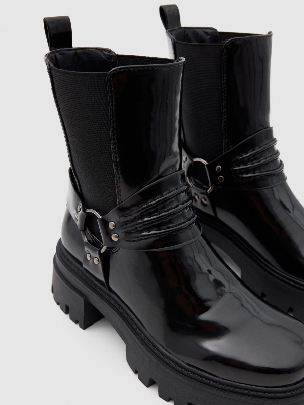 Patent leather ankle boots with straps black detail view