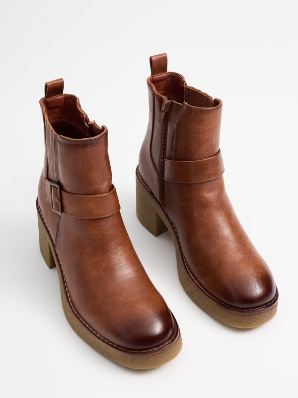 Brown boots with strap brown detail view