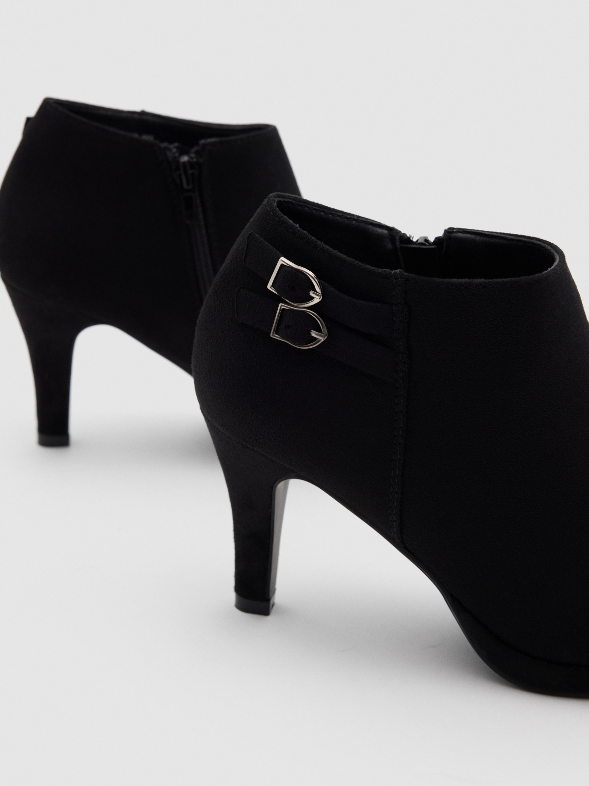 Heeled ankle boot with 2 buckles black detail view