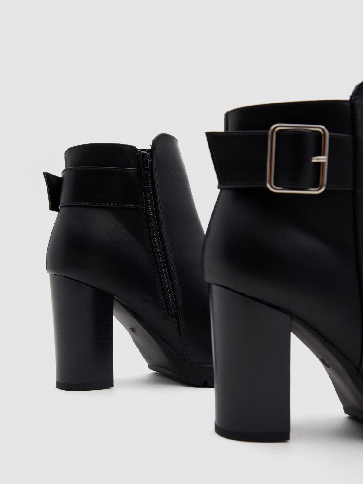 Wide-heeled boots with buckle black detail view