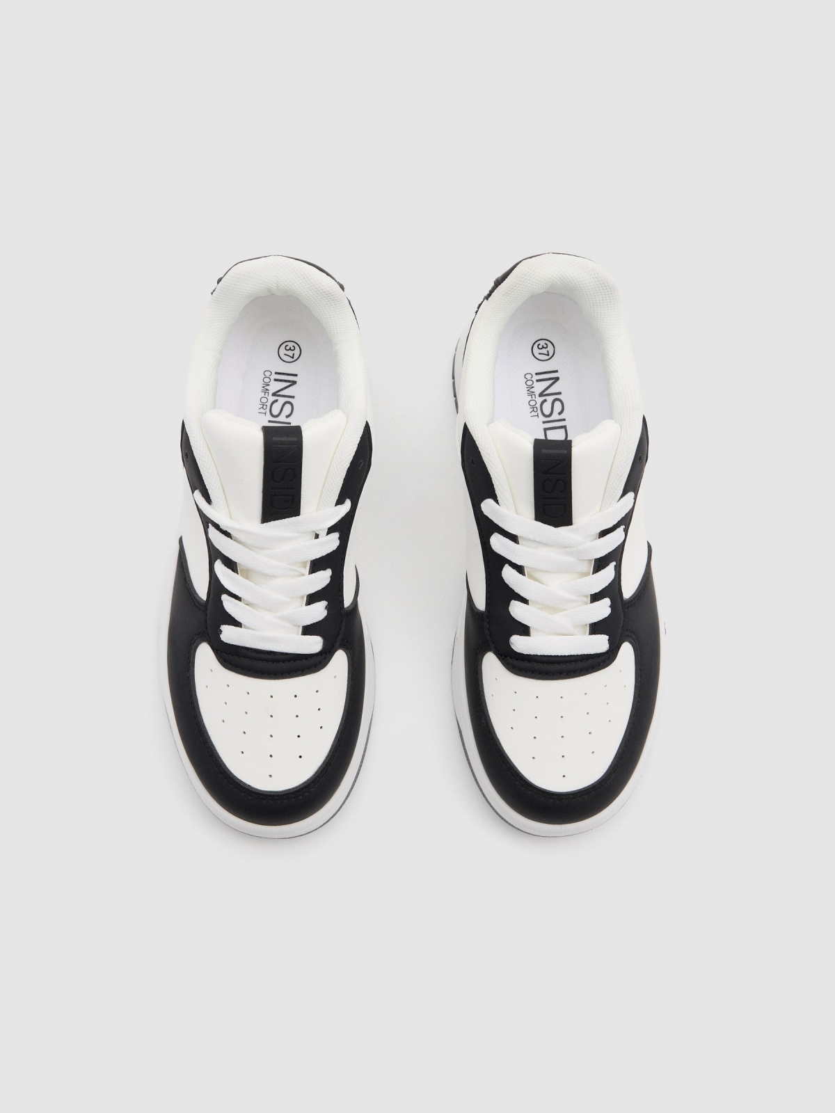 Casual sneakers combined with faux leather white detail view