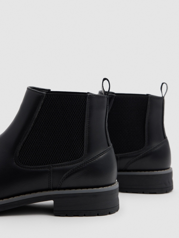 Black faux leather Chelsea boots black detail view