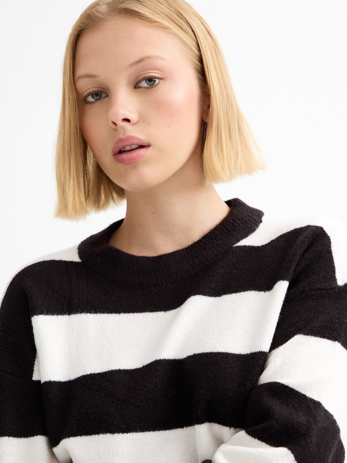 Black and white striped jumper black detail view