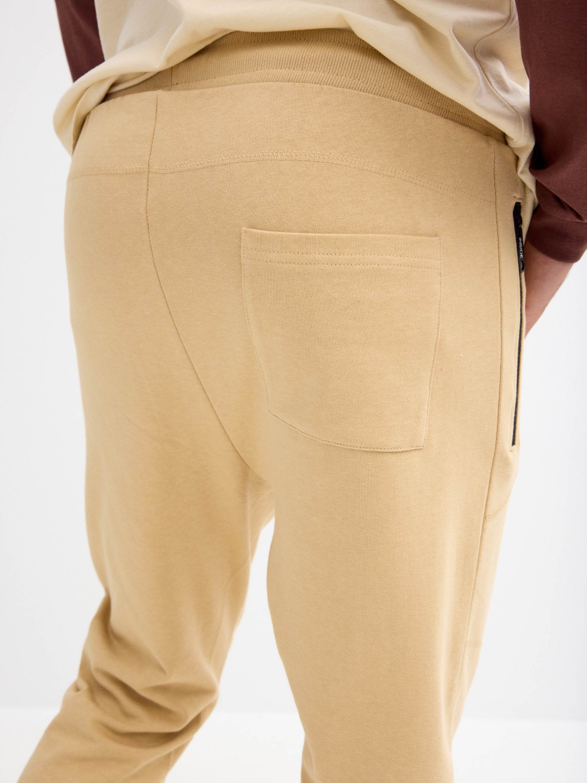 Jogger pants with pockets sand detail view