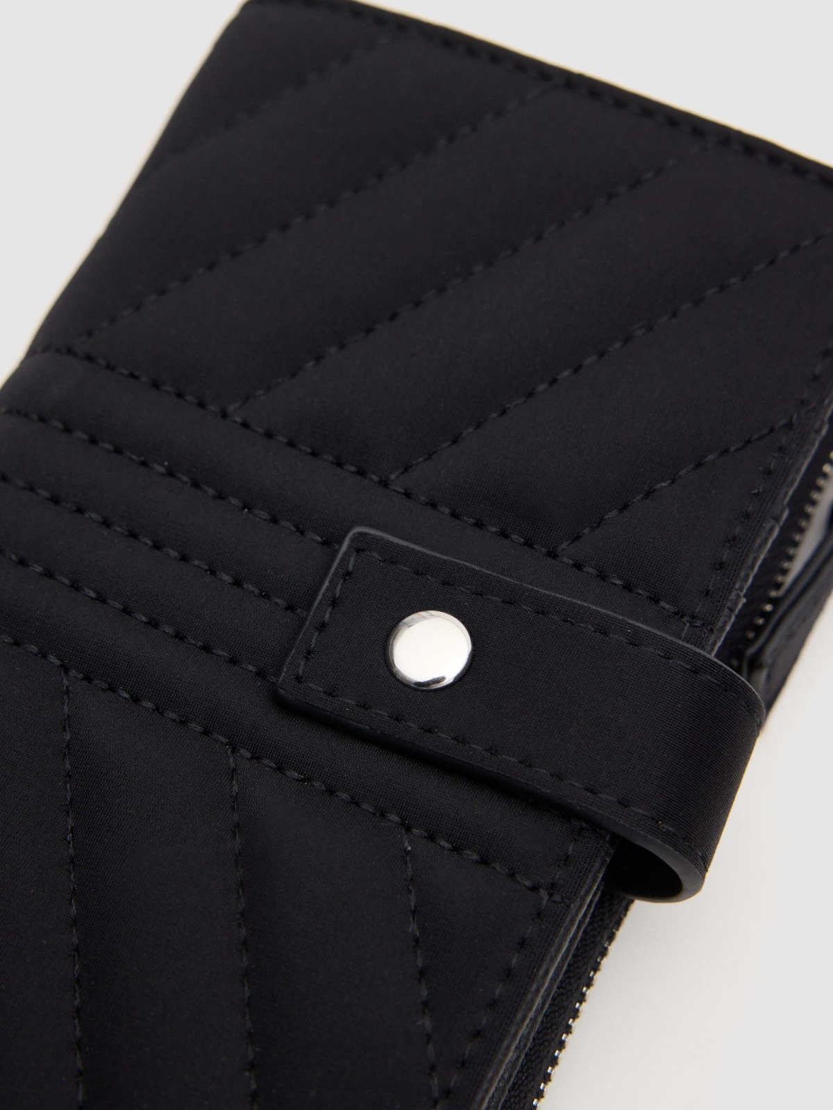 Quilted wallet black with a model