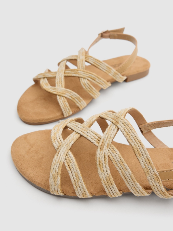 Raffia straps sandal sand detail view