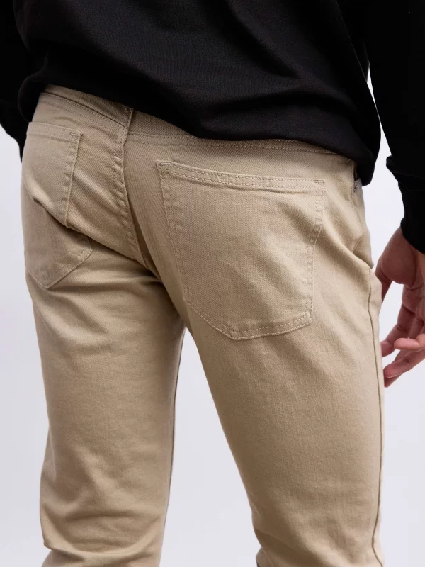 Coloured slim jeans beige detail view