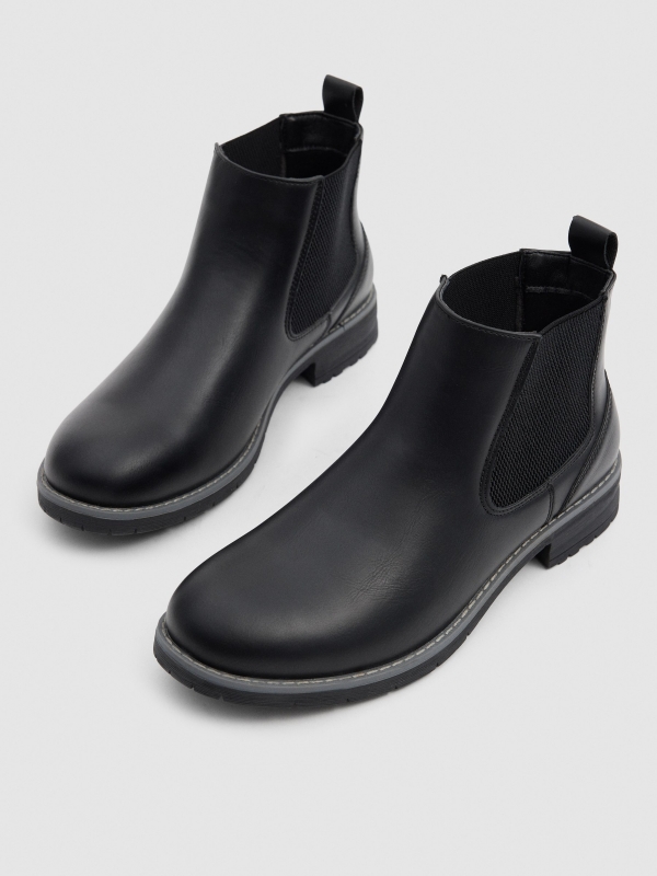 Black faux leather Chelsea boots black detail view