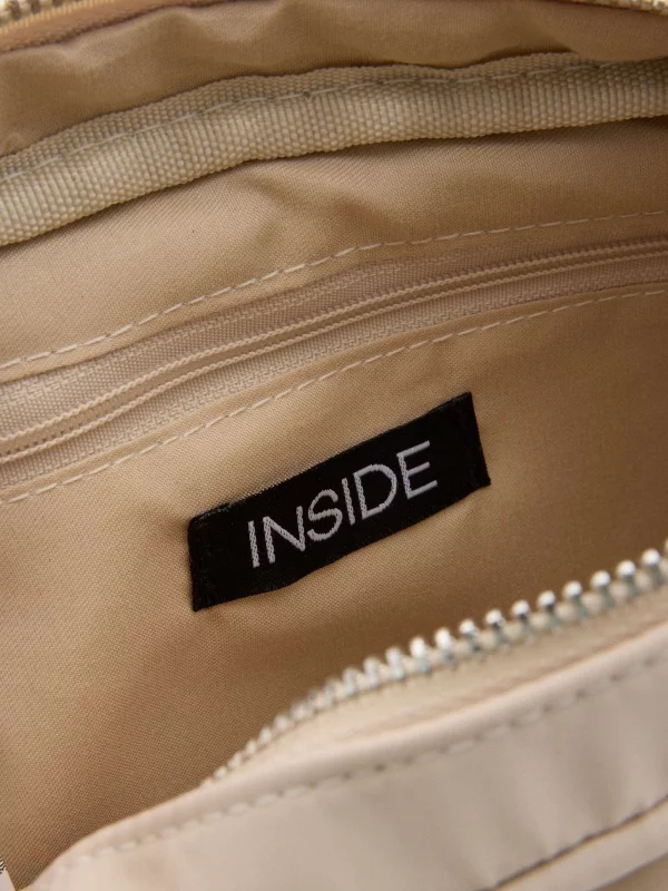 Padded shoulder bag sand detail view