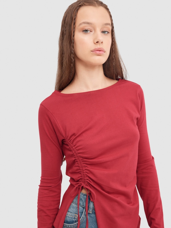 Long sleeve black t-shirt with ruching garnet detail view