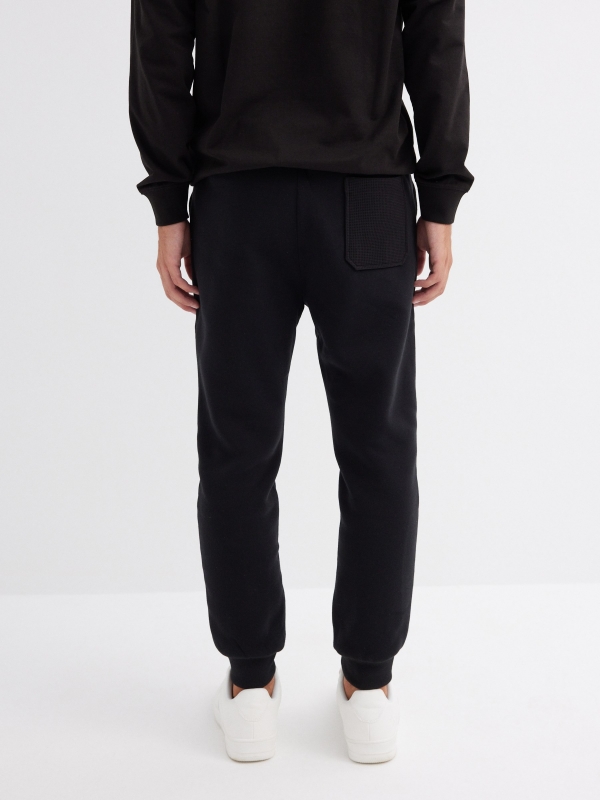 Basic jogger trousers black black middle back view