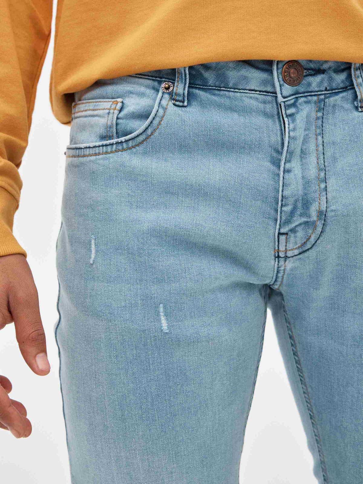 Super Slim Jeans light blue mustard detail view