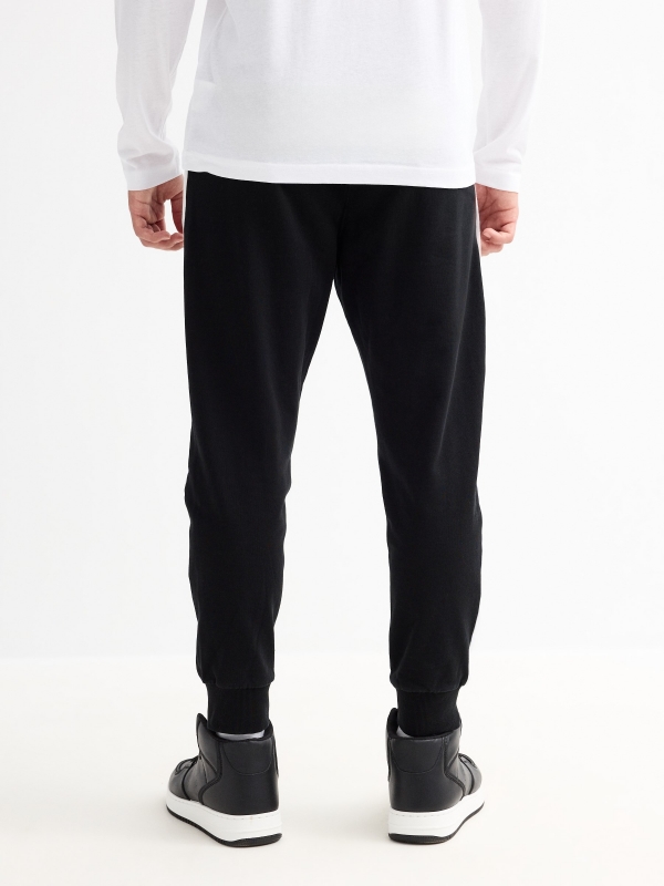 Redemption jogger trousers black middle back view