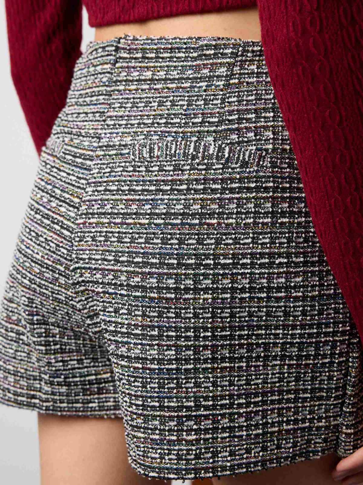 Tweed skort with buckle black detail view