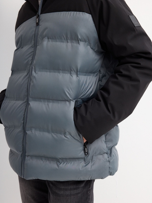 Blue block color quilted coat black detail view