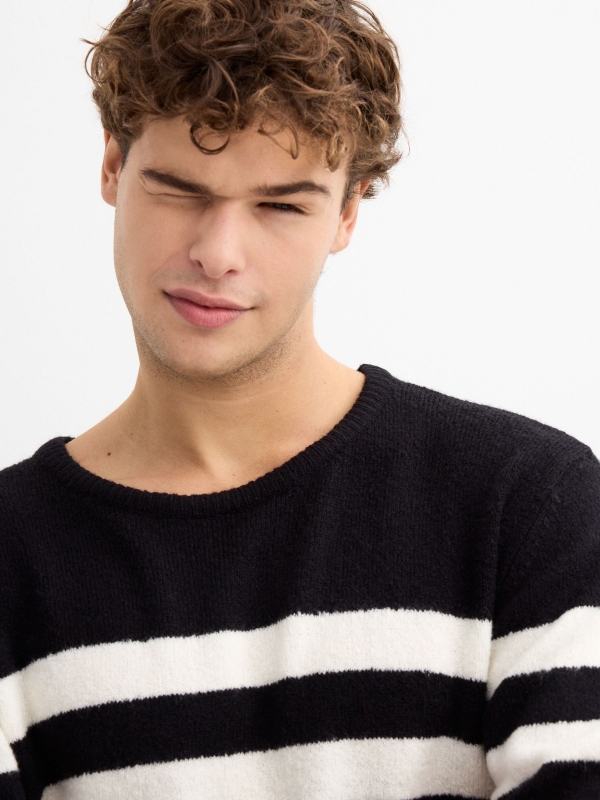 Contrasting striped jumper black detail view