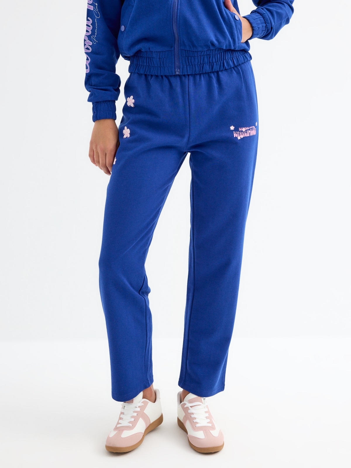 Jogger pants with flowers dark blue middle front view