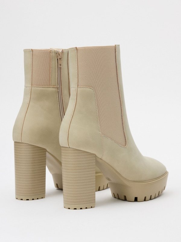 Patent leather ankle boots with elastic beige 45º back view