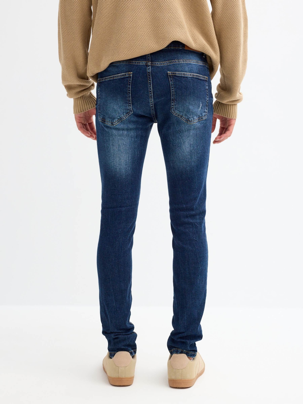 Jeans super slim denim desgastados azul vista media trasera