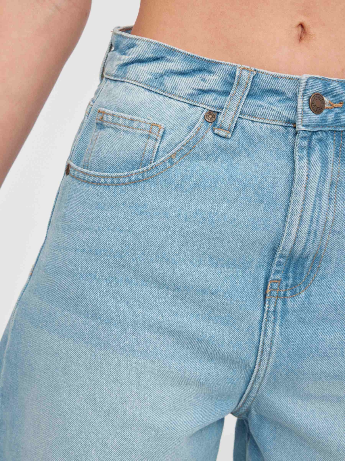 High-waisted denim shorts light blue back detail view