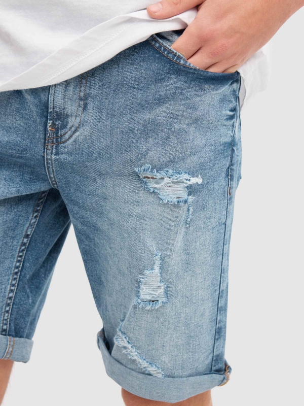 Worn denim bermuda blue detail view