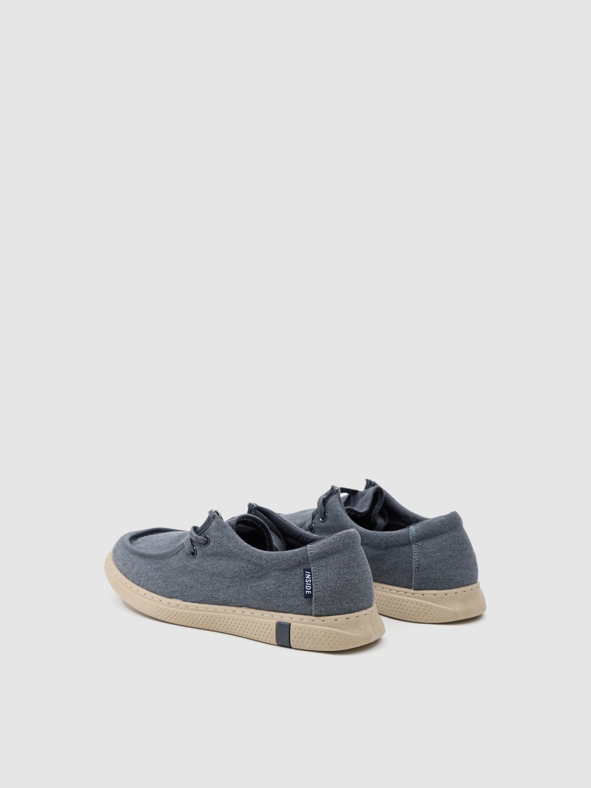 Denim canvas sneaker steel blue 45º back view