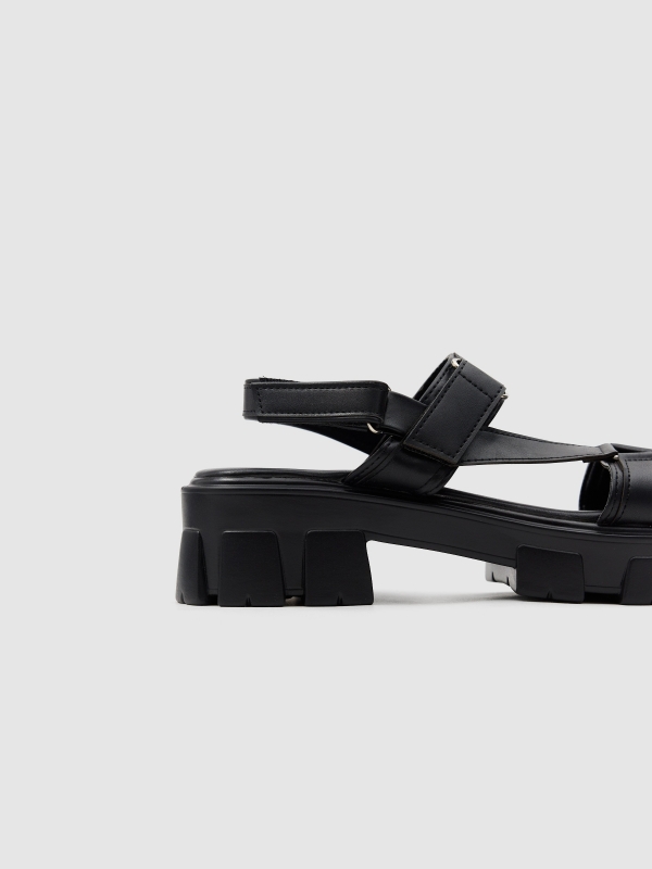 Platform track sandal black with a model