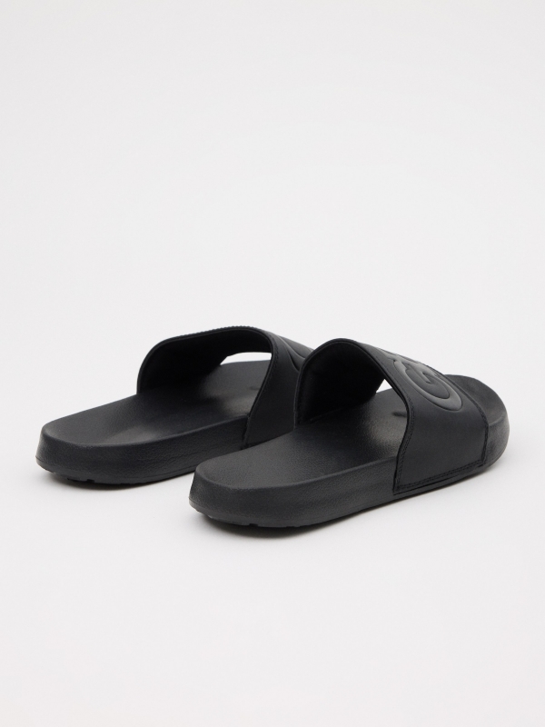 Embossed leather-effect shovel flip-flops black 45º back view