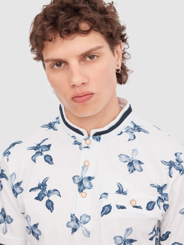 Tropical print polo white detail view