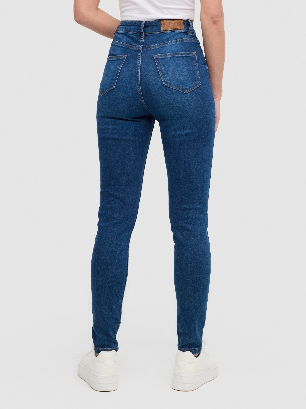 High rise skinny jeans blue middle back view