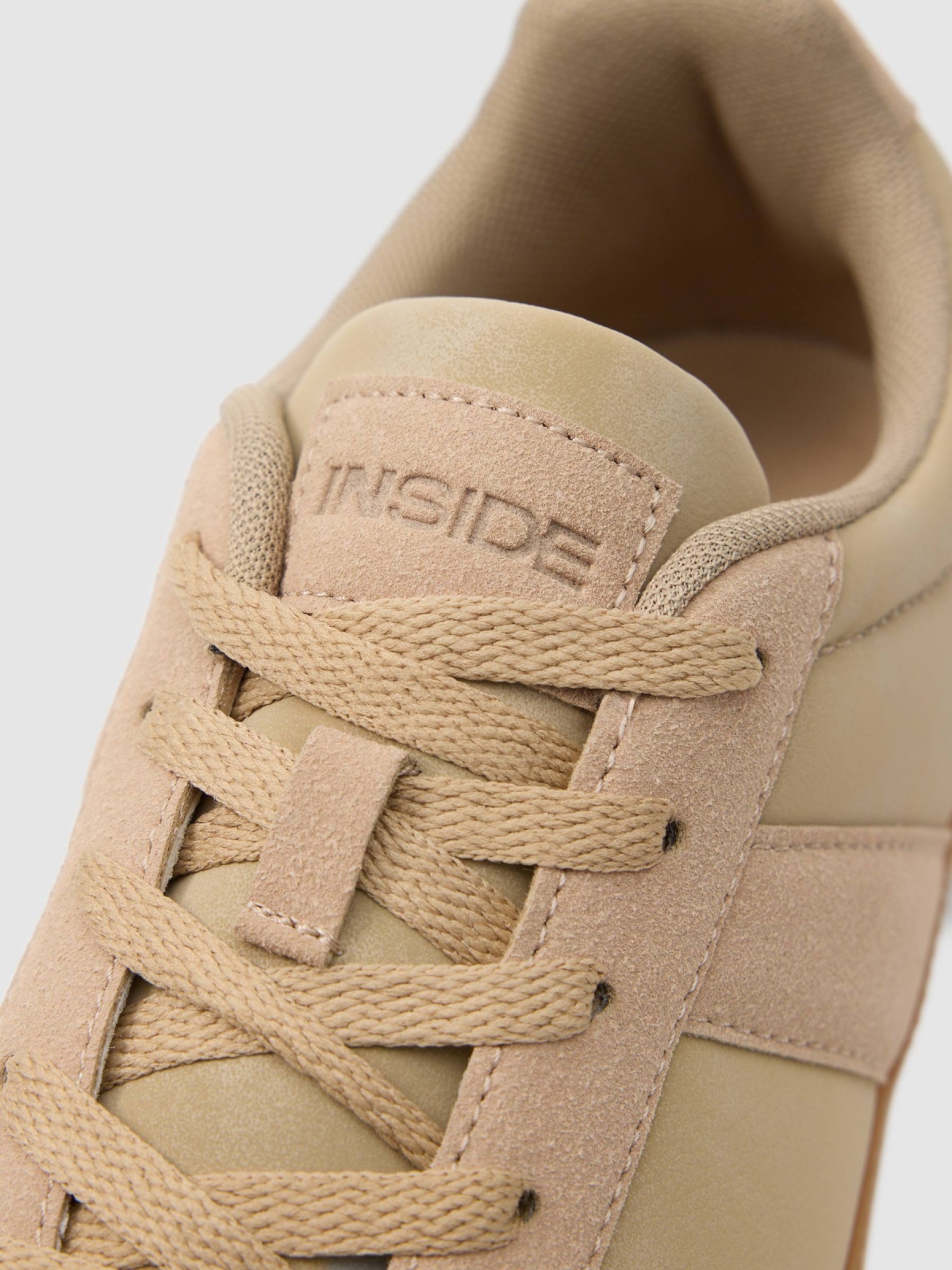 One-colour retro sneaker sand detail view