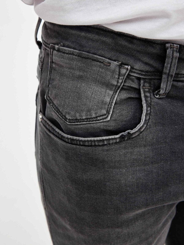 Washed gray denim bermuda shorts dark grey detail view