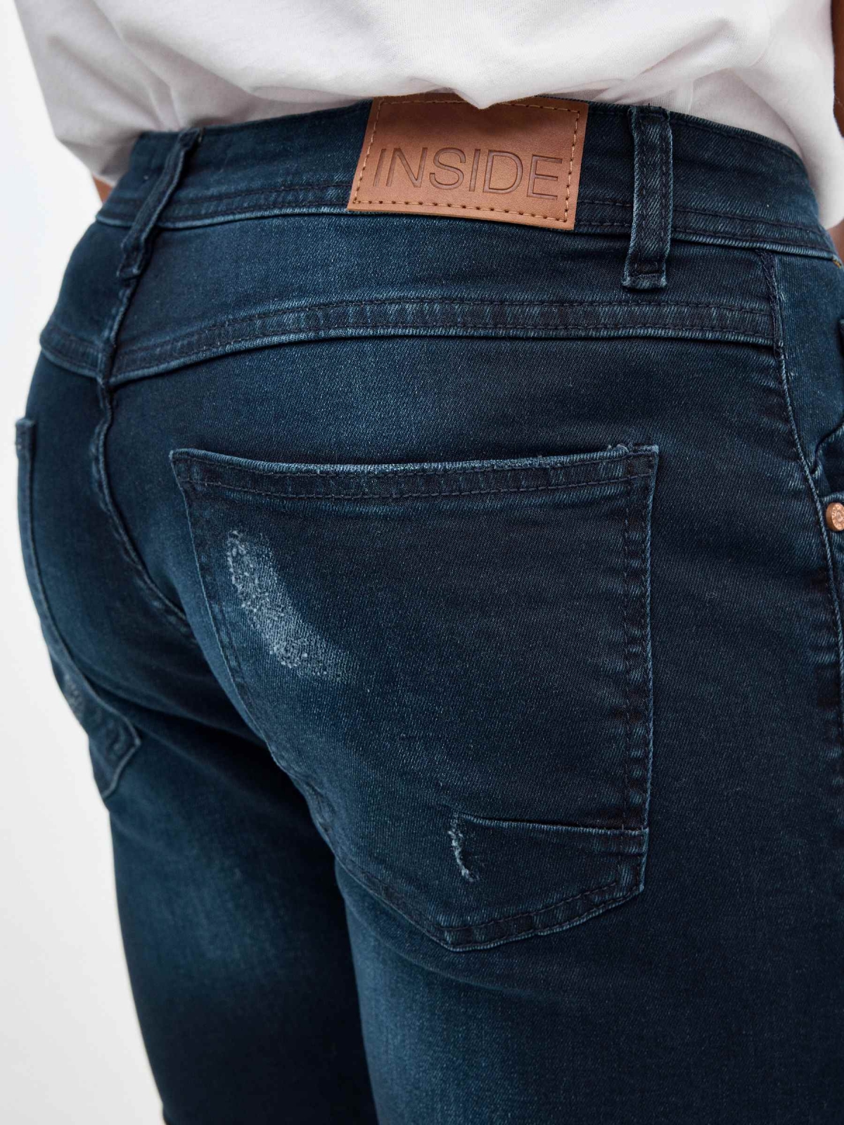 Ripped dark blue denim bermuda short blue detail view