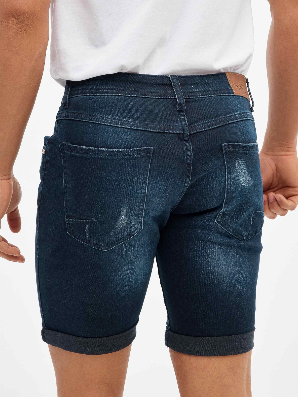 Ripped dark blue denim bermuda short blue detail view