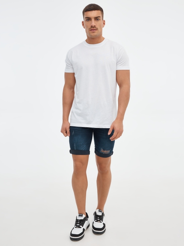 Ripped dark blue denim bermuda short blue front view