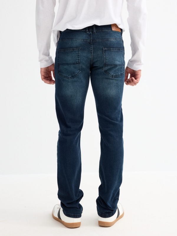 Navy blue slim jeans dark blue middle back view