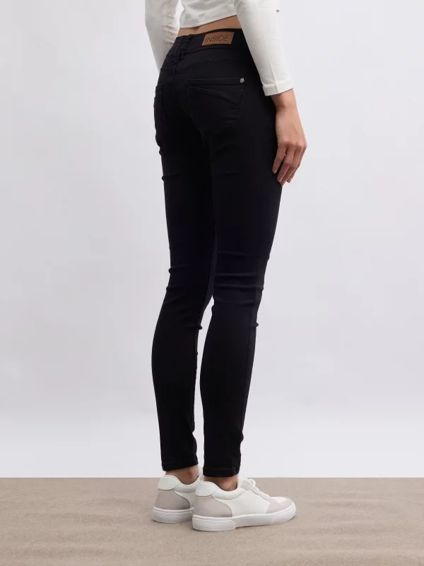 Thigh faint washed double button low-rise skinny jeans black middle back view