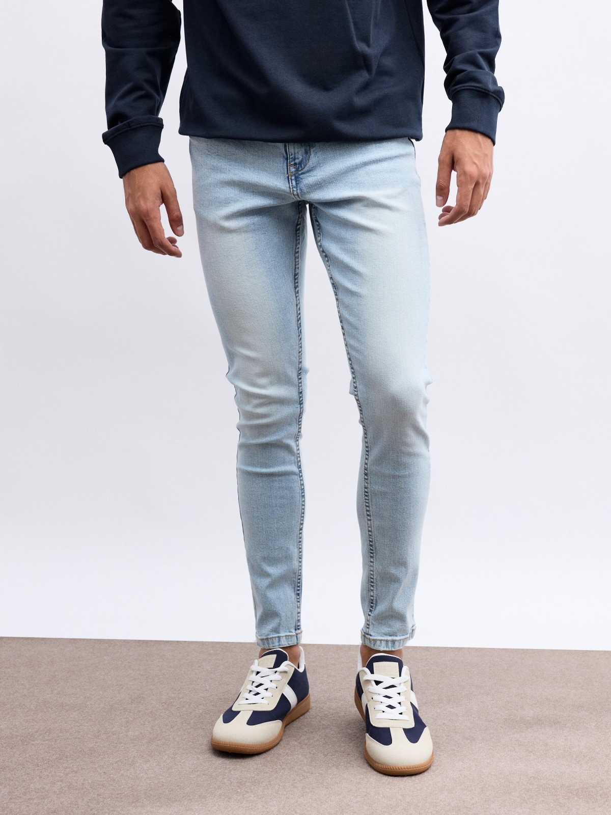 Light denim skinny jeans blue middle front view