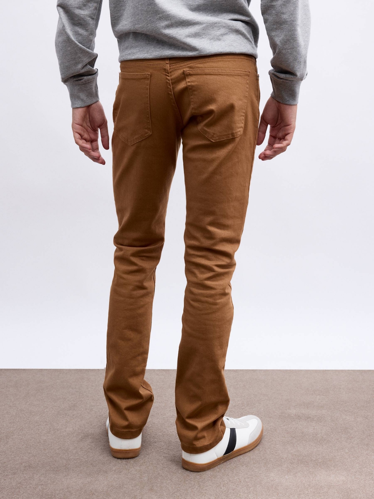 Basic colored jeans brown middle back view