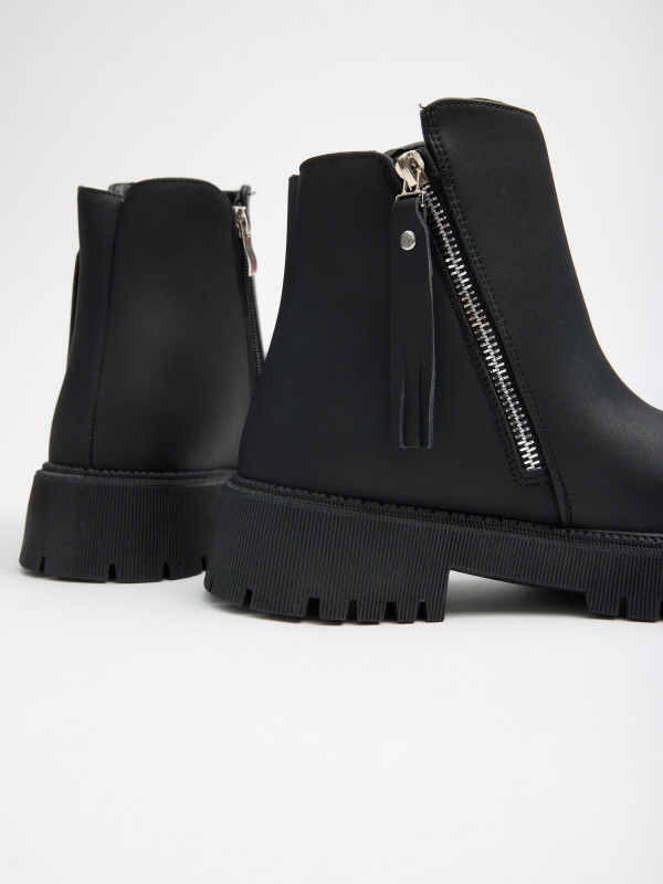 Black platform boot with zipper black detail view