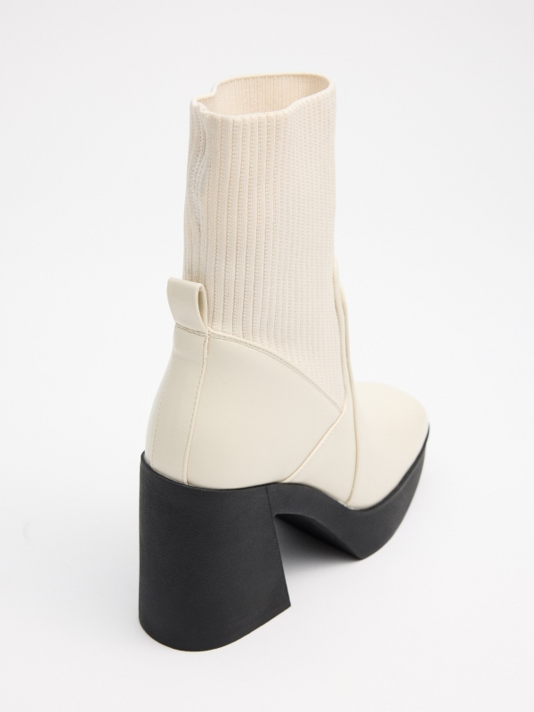 Boot with heel and elastic shaft white detail view