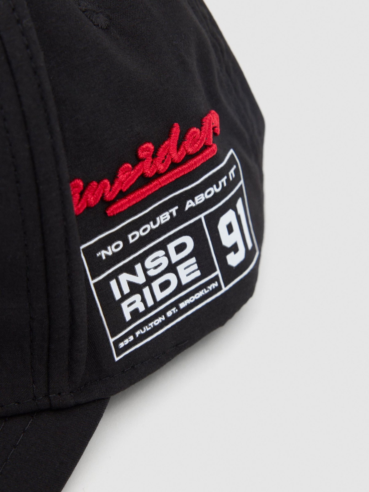 Baseball cap logo black detail view