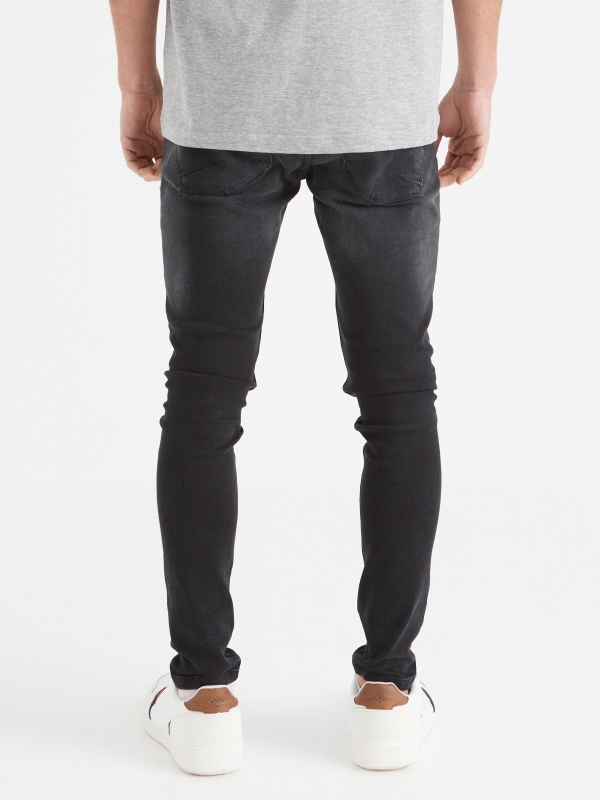 Washed black super slim jeans black middle back view