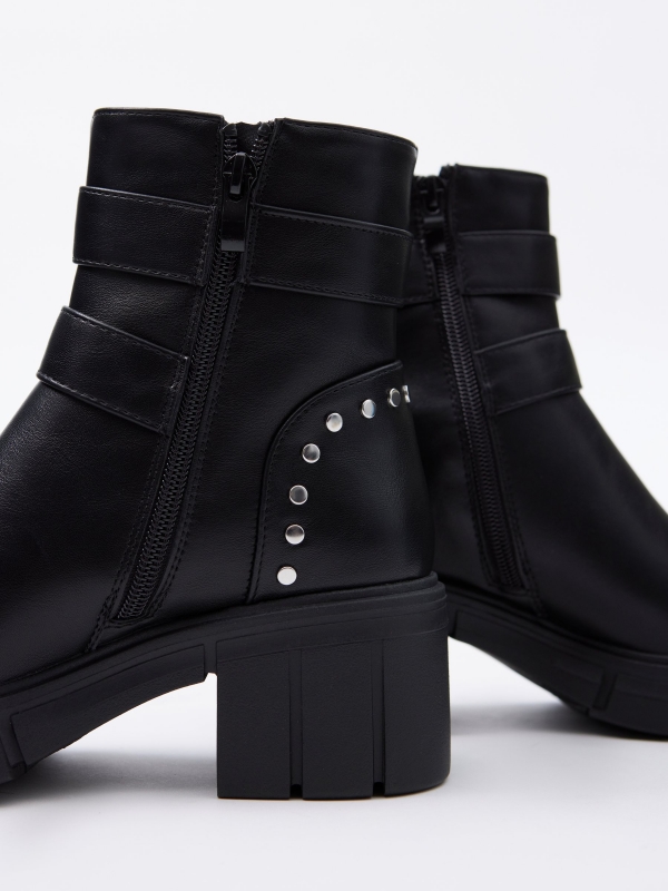 Ankle boot with track sole buckles black detail view