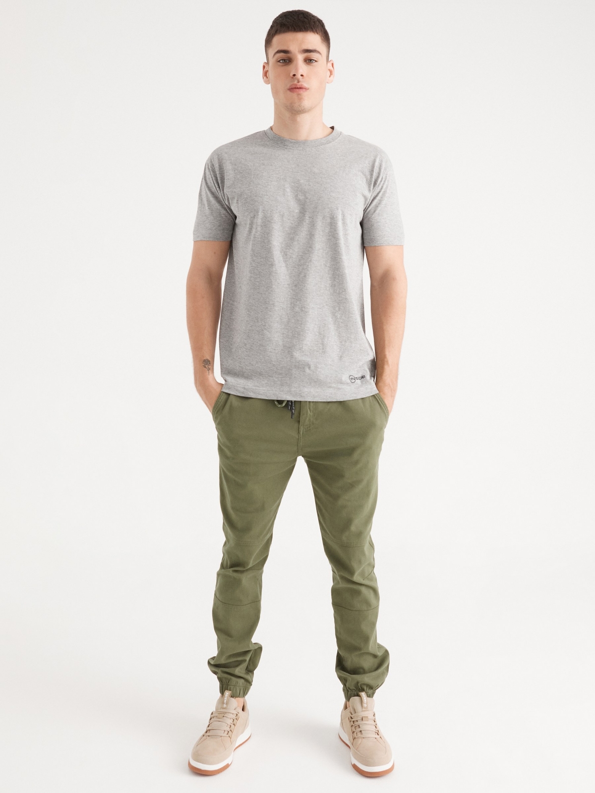 Joggers with seams green general front view