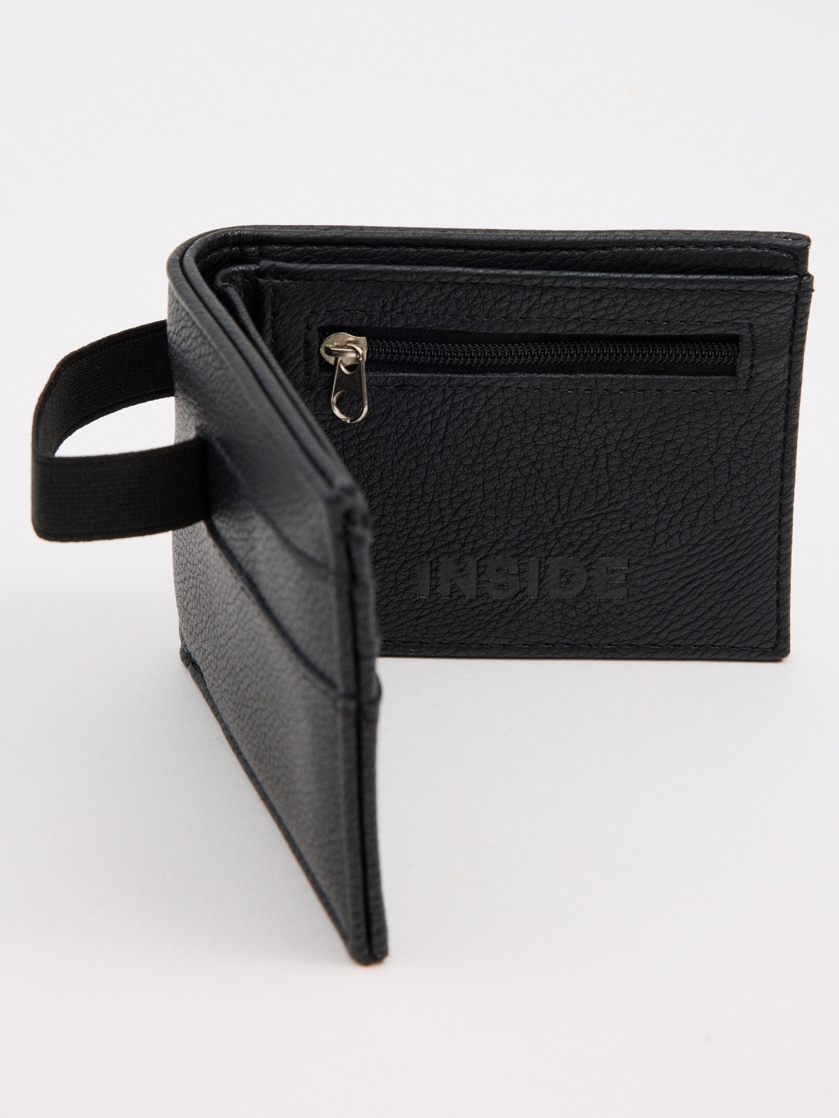 Cartera efecto piel elástico negro vista trasera