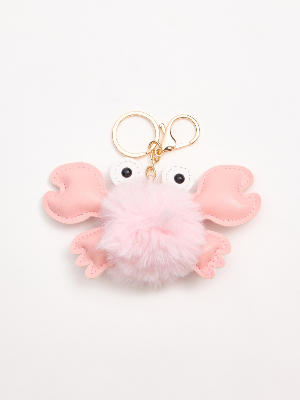 Crab pompom keychain foreground with a model