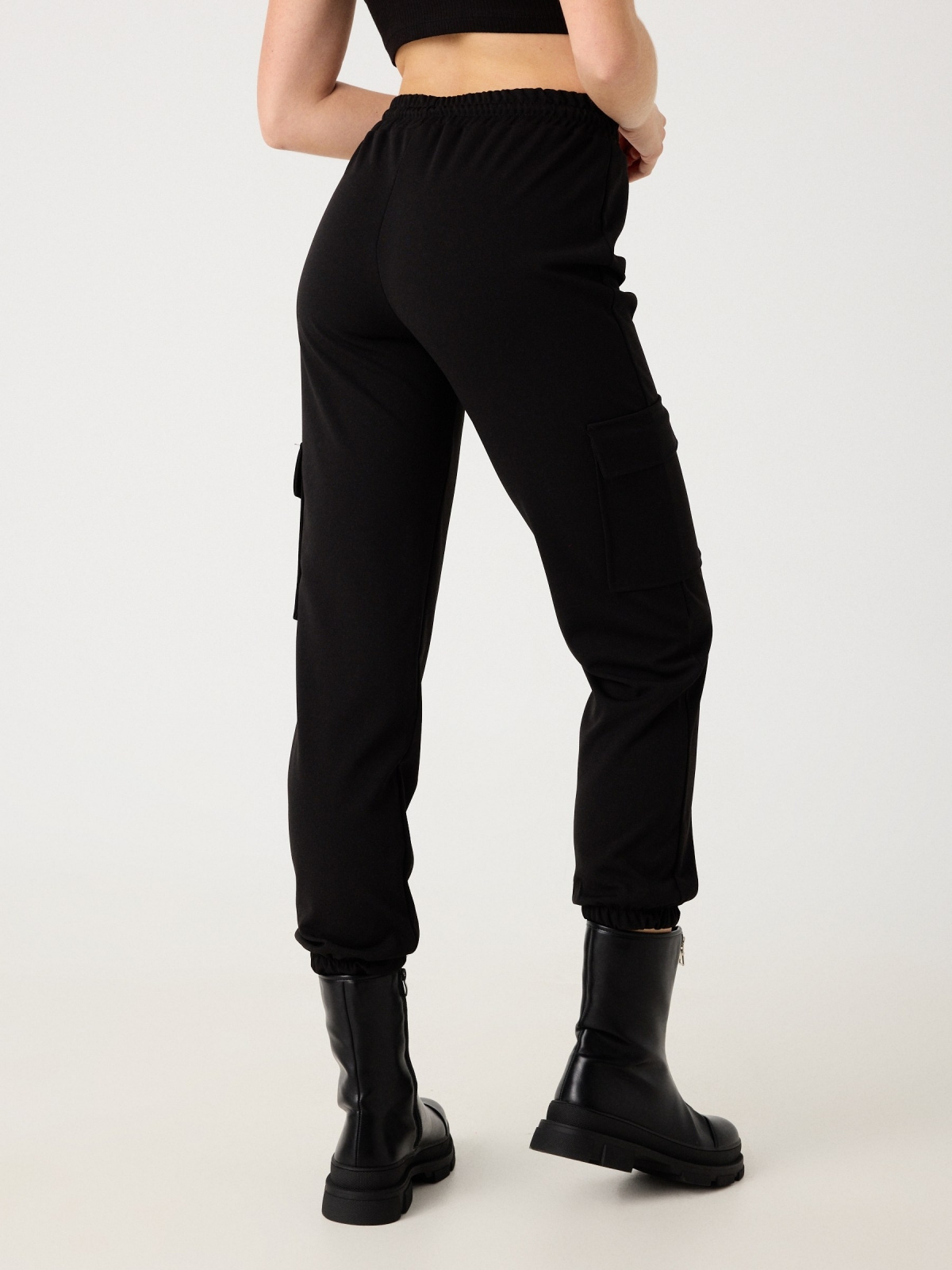 Rubber cargo pants black middle back view